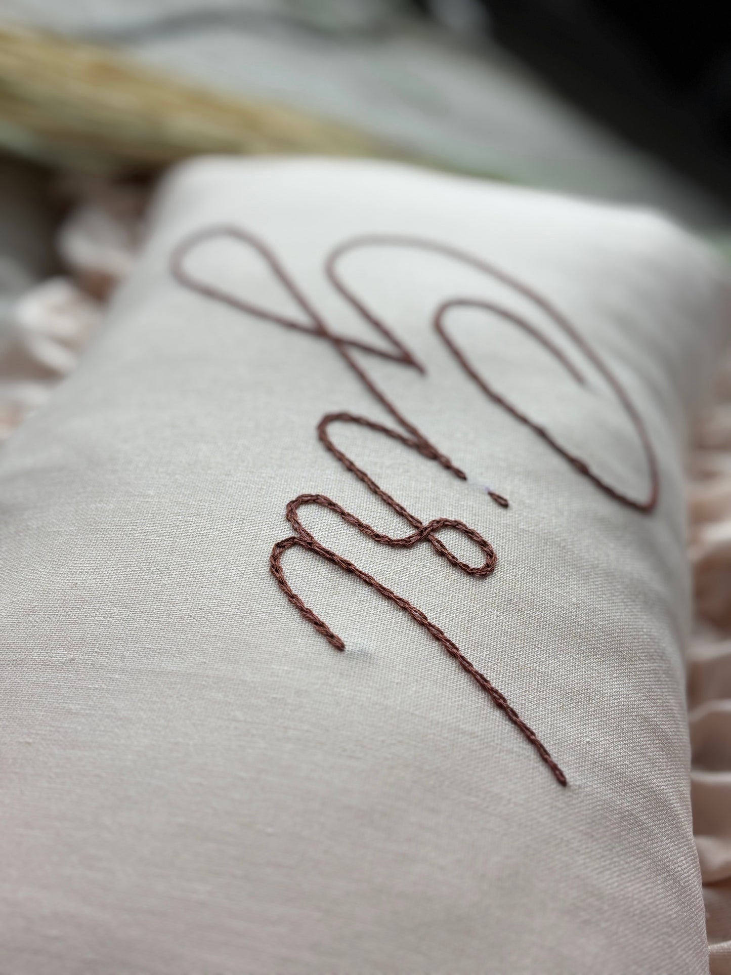 Linen pillow with embroidered name