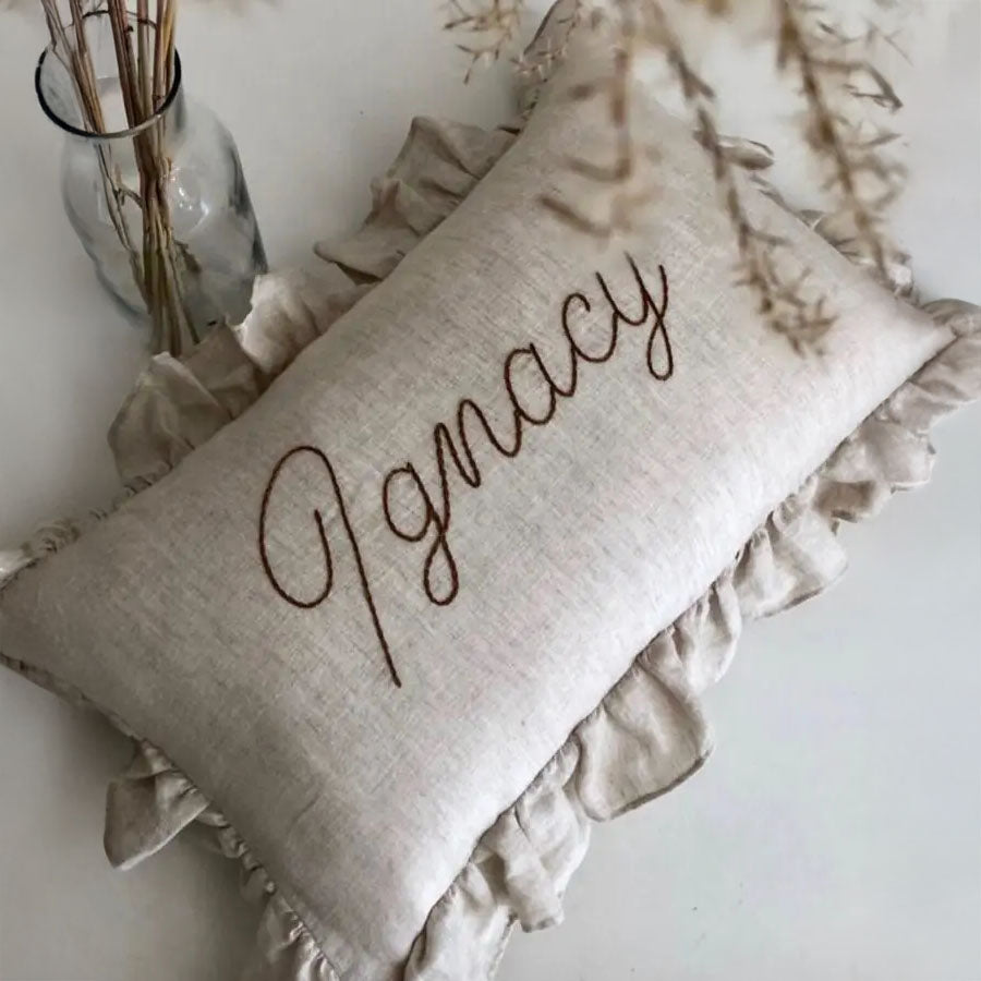 Linen pillow with embroidered name